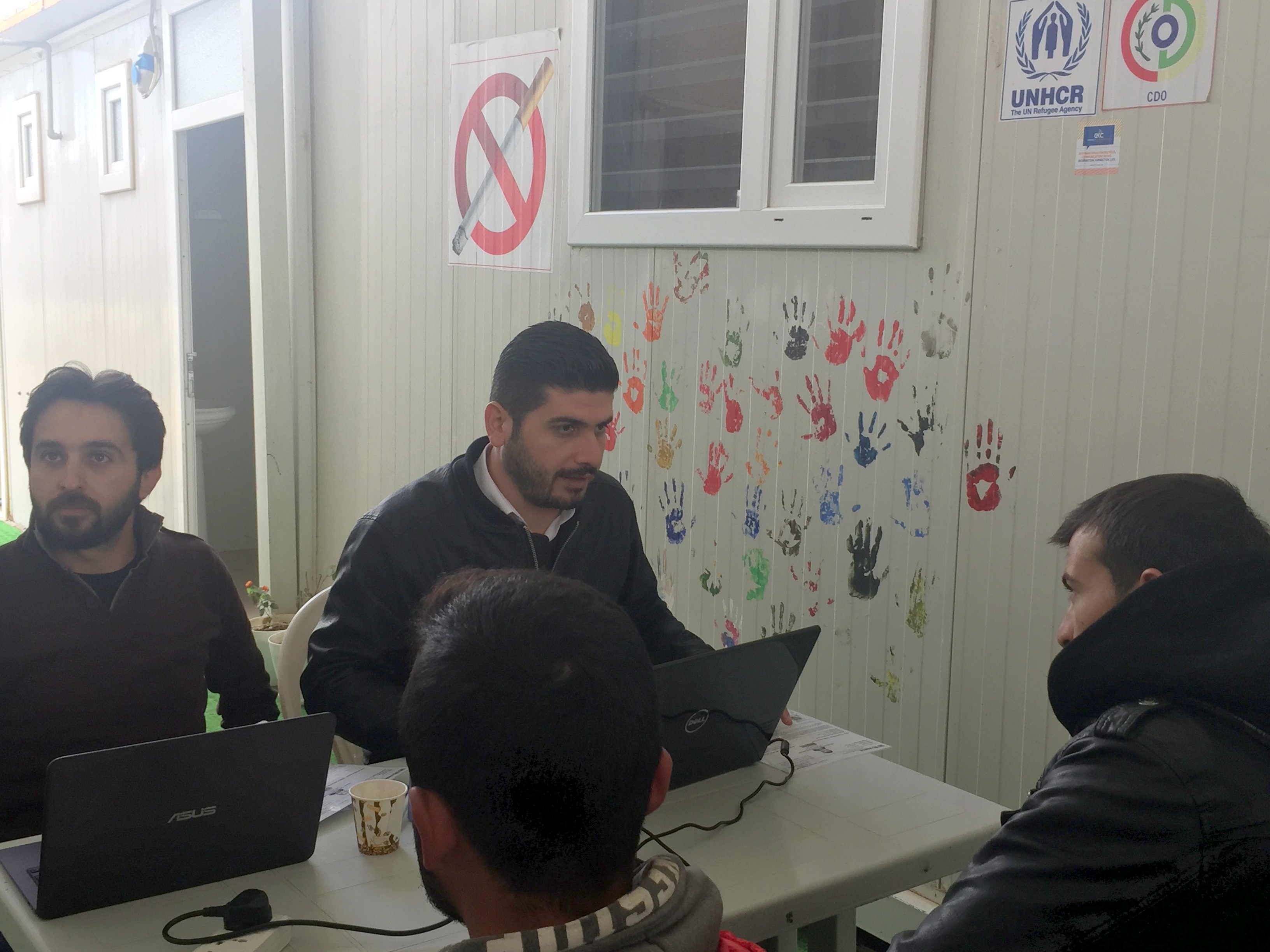 Syrians being registered before taking the online entry exam. Syrians being registered before taking the online entry exam.